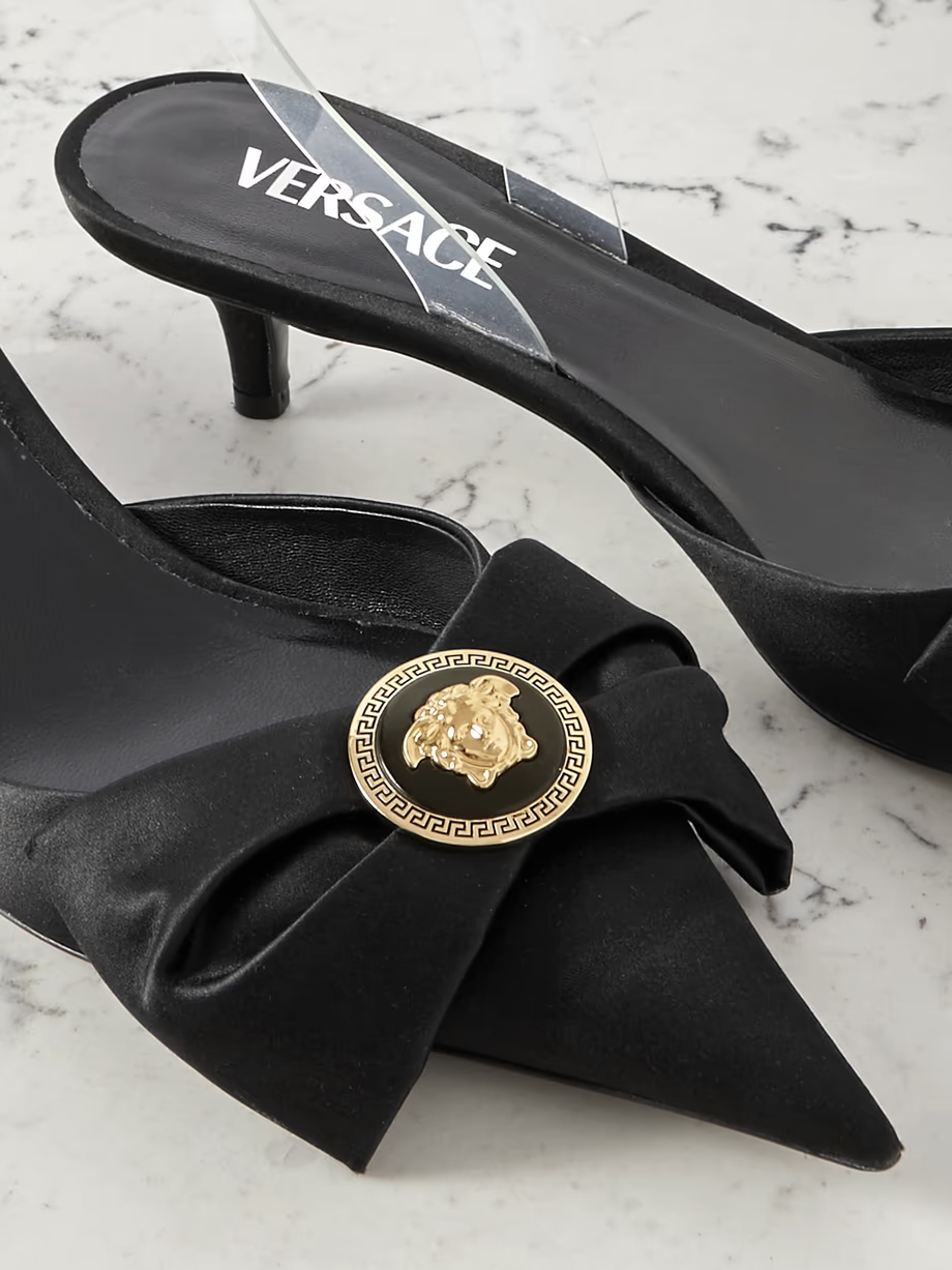 Medusa bow embellished rubber-trimmed satin slingback pumps Medusa bow embellished rubber-trimmed satin slingback pumps